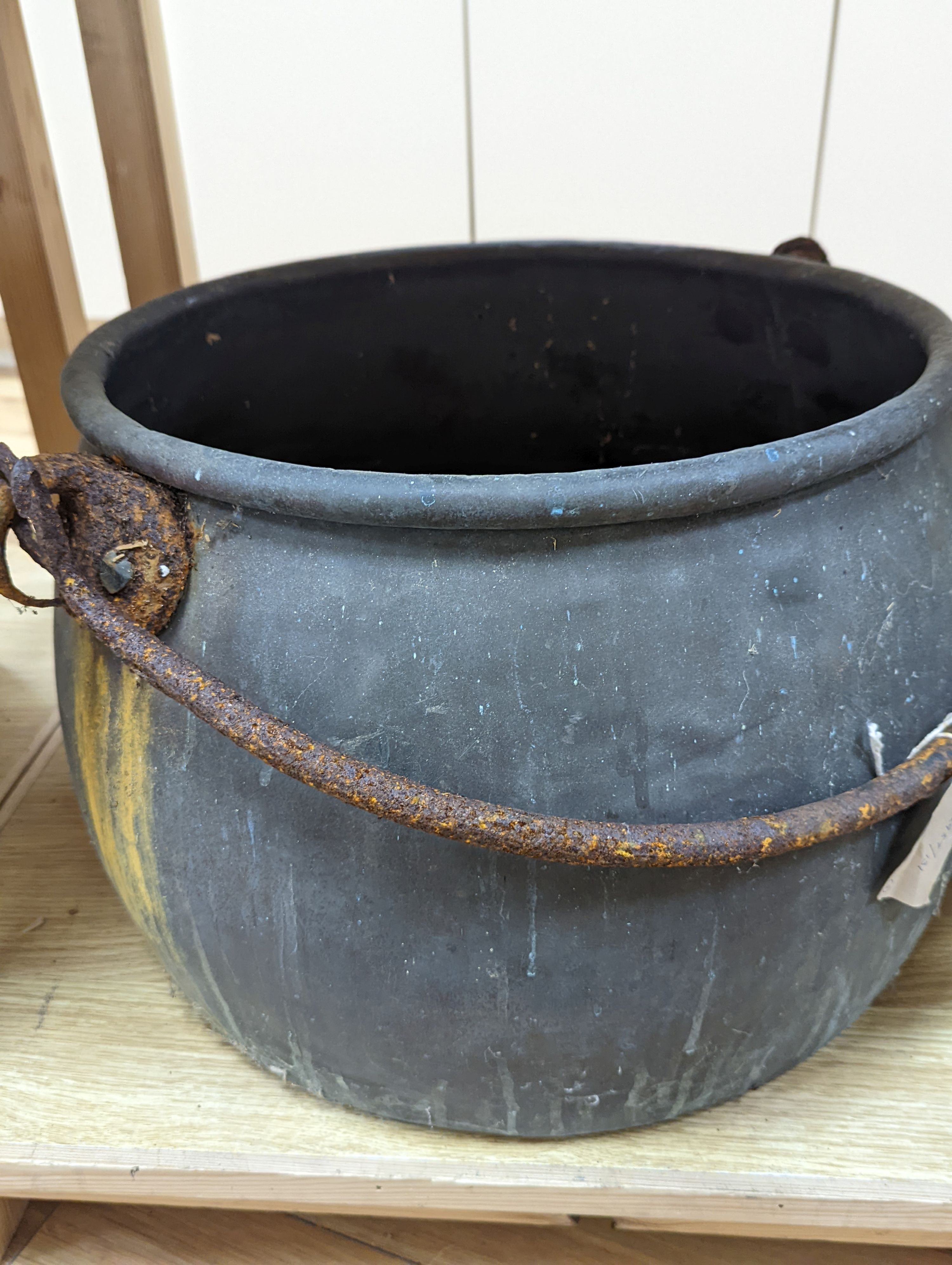 A large copper cauldron, 54cm wide and watering can